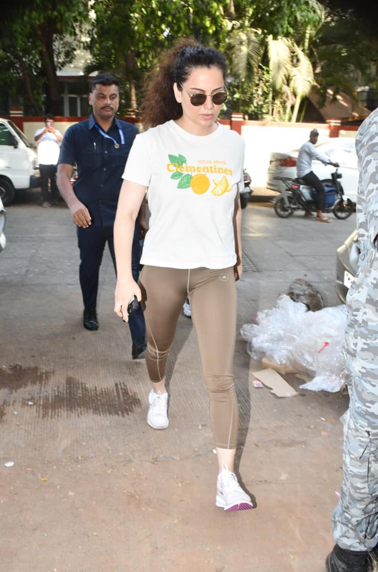 Kangana Ranaut was seen keeping it casual during her latest outing in the city. The actress opted for a white graphic T-shirt paired with beige tights and white sneakers.